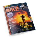 Titelblatt des Magazins „mountainBIKE“ mit einer Silhouette einer Person auf einem Mountainbike vor orange-gelbem Sonnenuntergang. Textelemente: „Der PREIS ist HEISS“, „21 Enduro- & Trail-Reifen im Test“, „ZELL AM SEE“, „orbea – Das neue E-MTB-Flaggschiff exklusiv getestet“, „Shimano XT Di2 im Stresstest“, „Neu: 16 Seiten Community“. Links unten ein lilafarbenes Mountainbike auf dunklem Untergrund.