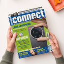 Zwei Hände mit grünen Ärmeln halten das Technikmagazin „connect“, Ausgabe mit blau-weißem Titelkopf und Unterzeile „Die Test-Instanz für Smartphones und Connectivity“. Auf dem Cover ein großes Foto einer Hand mit Smartphone „Leica Leitzphone“, dazu Textabschnitte „WM-Spezial“, „Viel Technik, kleiner Preis“, „Auf und in die Ohren“ und „Besser als Apple“ auf grünem, blauem und gelbem Hintergrund, im oberen Bereich ein kleines Kameraabbild.