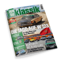 Schräg fotografiertes Cover der Zeitschrift „Klassik Auto Bild“ mit einem beigefarbenen Mercedes mit Dachgepäckträger auf einer Wüstenstraße, roter Marokko-Flagge und mehreren Oldtimern. Sichtbare Texte: „W123 Challenge“, „Die Jagd auf N 123“, „Im alten Benz quer durch Marokko“ und „Klassiker bis 10.000 Euro – Der günstige Einstieg in die Oldtimerwelt“.
