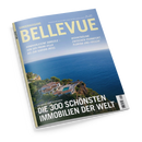 Schräg fotografiertes Magazin „BELLEVUE“ mit hellblauem Cover und dem Aufdruck „SONDERAUSGABE“. Sichtbar sind ein weißer Villenkomplex mit Pool an einer felsigen Küste, blaues Meer sowie die Texte „HANDVERLESENE DOMIZILE – VON DER PROMI-VILLA BIS ZUR KARIBIK-INSEL“, „WOHNTRÄUME ZWISCHEN FRANKFURT, FLORIDA UND FIDSCHI“ und „DIE 300 SCHÖNSTEN IMMOBILIEN DER WELT“.