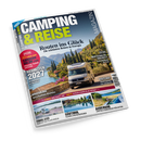 Schräg dargestelltes Magazin „CAMPING & REISE“ mit blauem Titelbild, weißer und gelber Schrift sowie dem Text „Routen ins Glück – Die schönsten Reisen in Europa“. Abgebildet sind ein weißes Wohnmobil auf einer Straße, eine mediterrane Landschaft und kleinere Reisefotos; sichtbar sind außerdem „CARAVAN SALON“, „Neuheiten“, „Vogtland“, „Münsterland“, „Finnland“, „Südtirol“, „Auvergne“ und „www.wir-leben-outdoor.de“.