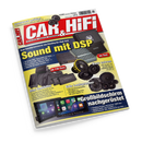 Schräg fotografiertes Cover der Zeitschrift „CAR&HIFI“ mit rotem, gelbem und blauem Layout auf schwarzem Hintergrund. Abgebildet sind mehrere schwarze Auto-Verstärker, Lautsprecher, Subwoofer und ein Autoradio mit großem Bildschirm; sichtbare Texte: „Sound mit DSP“, „Mini Endstufen“, „Edle Lautsprecher“, „Bass extrem“ und „Großbildschirm nachgerüstet“.