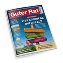 Schräg fotografiertes Titelbild des Magazins „Guter Rat“ mit blauem Hintergrund, rotem Kopfbereich und weißem Rand. Sichtbare Texte: „GELDANLAGE – Die neue Börsenblase und die Folgen“, „REFORMPAKET“, „Was kommt da auf uns zu?“, drei farbige Holzwegweiser mit „STEUERREFORM“, „RENTENREFORM“ und „PFLEGEREFORM“, außerdem Hinweise zu Digitalwährung, Urlaubszielen, Eiscreme, Wärmepumpenförderung und Heckenscheren; unten eine weibliche Radfahrerin.